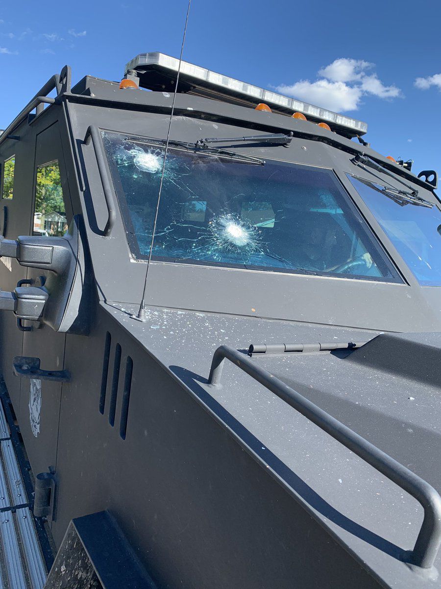 Armored vehicle hit by gunfire in standoff